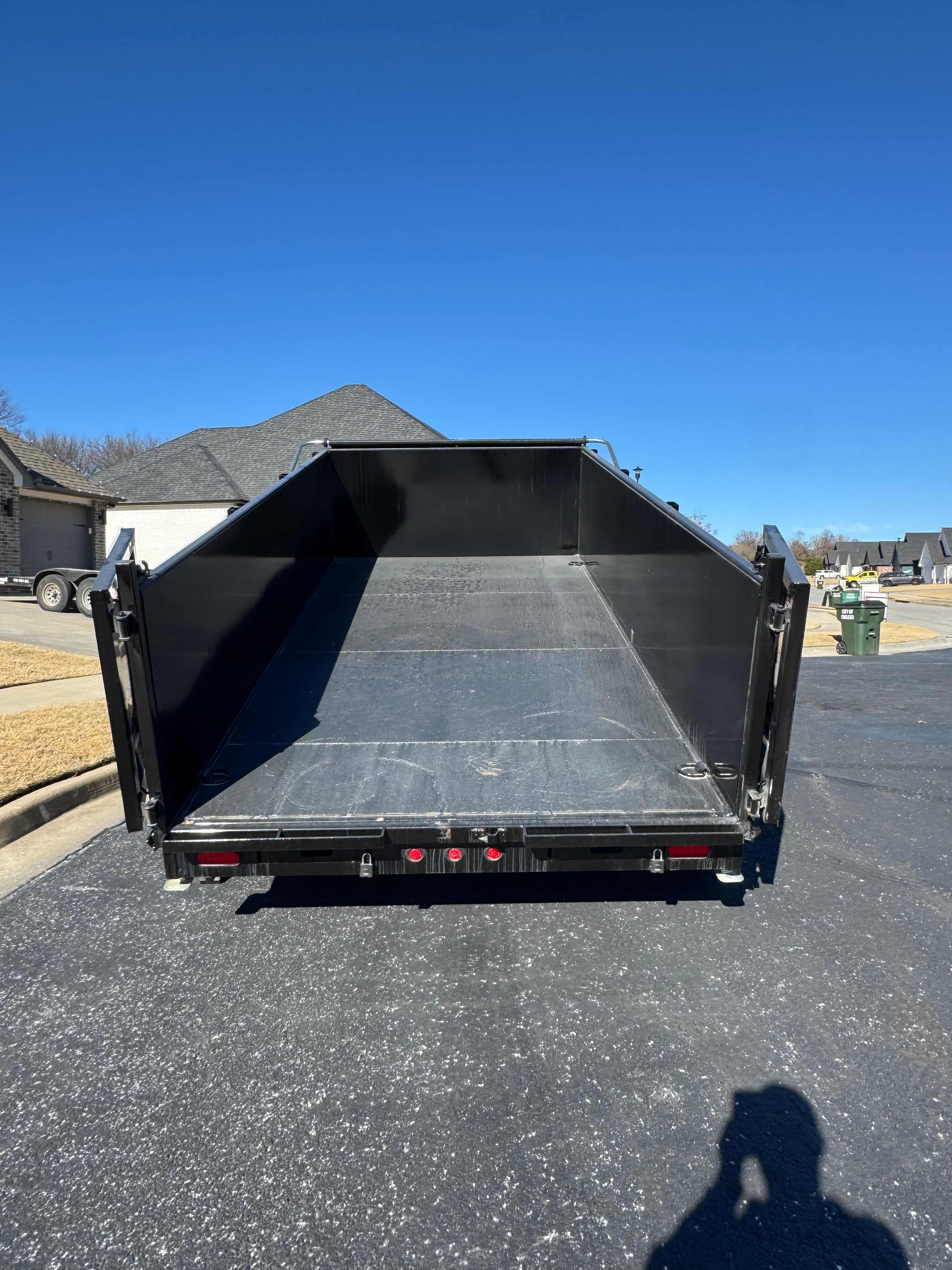 14 foot dump trailer full view with tarp system for debris hauling